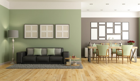 Dunkle Möbel kombiniert mit grüner Wandfarbe